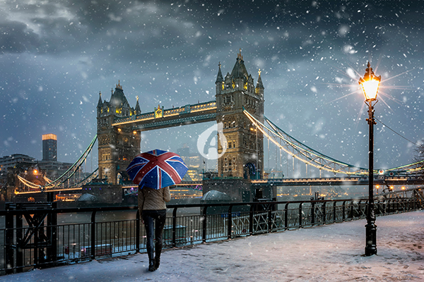 Tower Bridge during evening time with snowfall, London